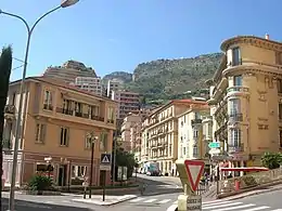Lamarck Square, Les Moneghetti; this square contains, a garden, a post office, and a police station; the parish church (Sacred Heart) is 46 metres (50&nbsp;yd) away.