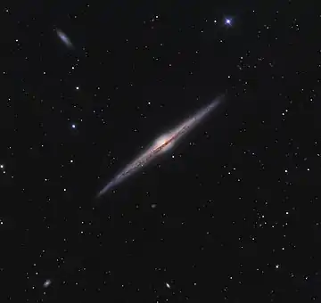 Image 15Needle GalaxyPhotograph: Ken CrawfordNGC 4565 (also known as the Needle Galaxy) is an edge-on spiral galaxy about 30 to 50 million light-years away in the constellation Coma Berenices. NGC 4565 is a giant spiral galaxy more luminous than the Andromeda Galaxy, and has a population of roughly 240 globular clusters, more than the Milky Way.More selected pictures
